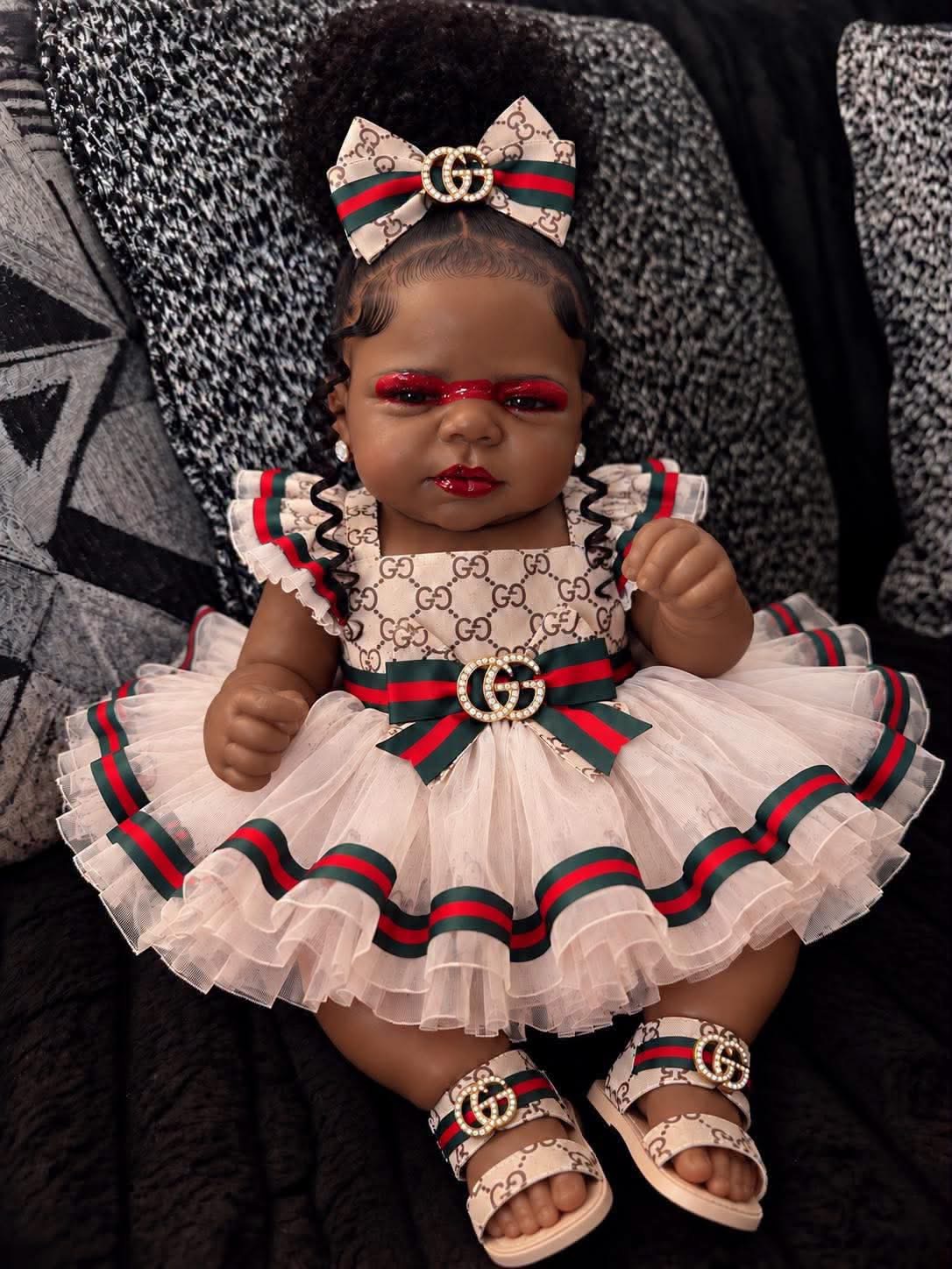Baby wearing a decorative dress and matching bow